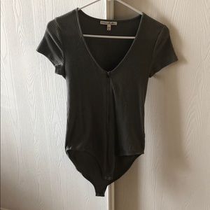 Body suit with zip up front